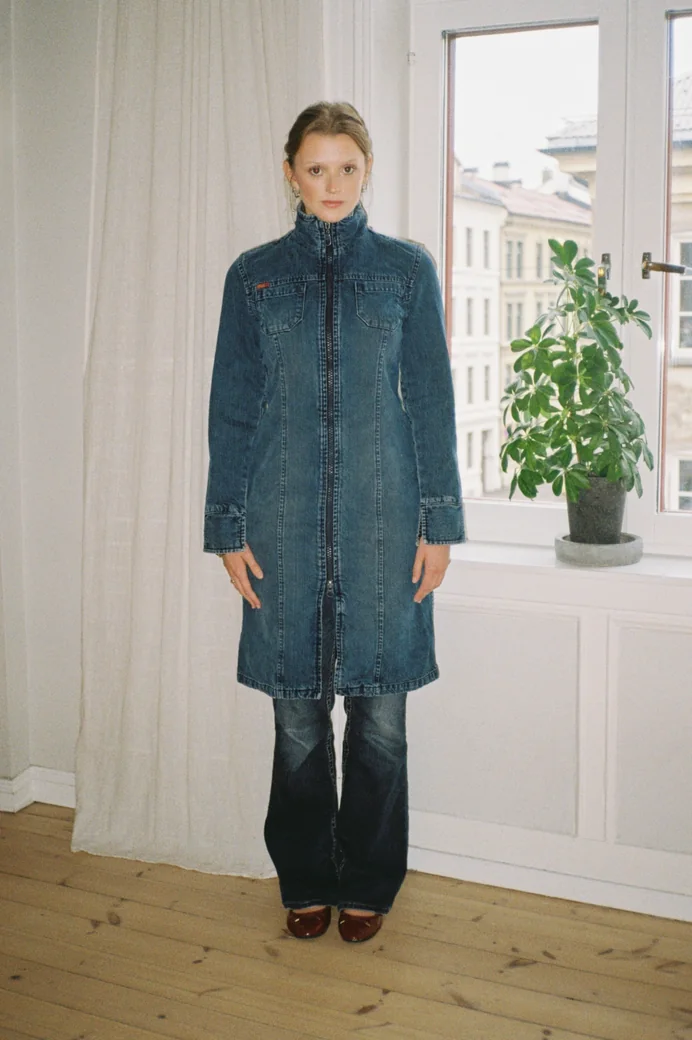 Long dark denim coat with a high collar